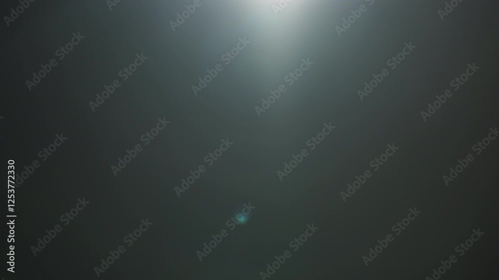 Real optic lens flare over black background for overlay or background Real optic lens flare over black background for overlay or background