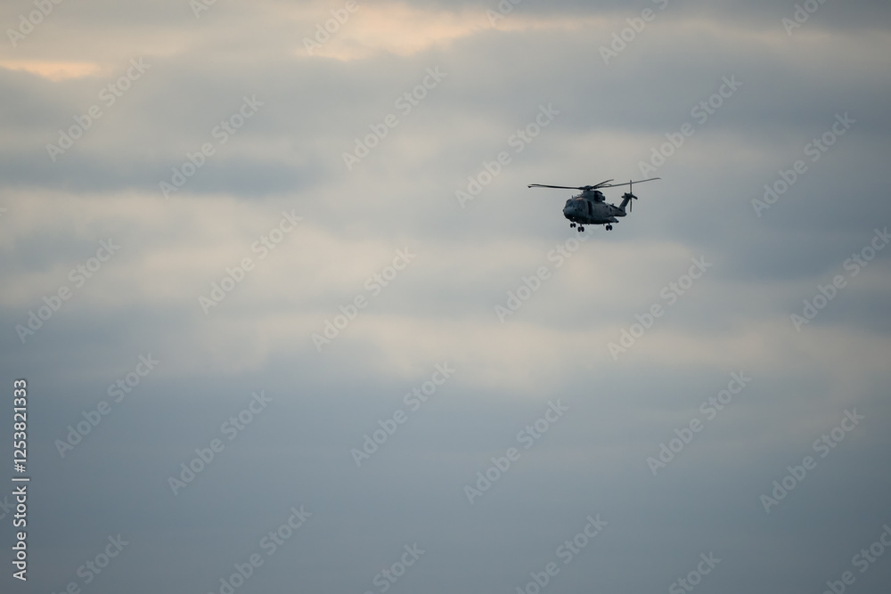 British Royal Navy Agusta-Westland Merlin HM.2 AW101 helicopter hovering on a military exercise 