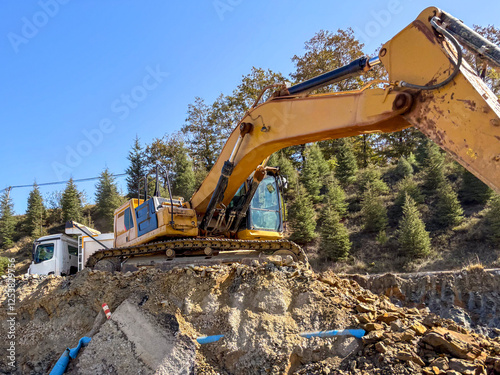 Road widening work on the side of the highway, Bulldozer and truck are working