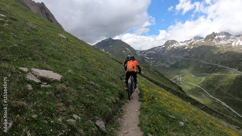 Mountain biking at high altitude on Barbellino MTB Trail, the sweeping views reveal distant peaks shrouded in mist, adding a sense of mystery. Mountain biking at high altitude on Barbellino MTB Trail, the sweeping views reveal distant peaks shrouded in mist, adding a sense of mystery.