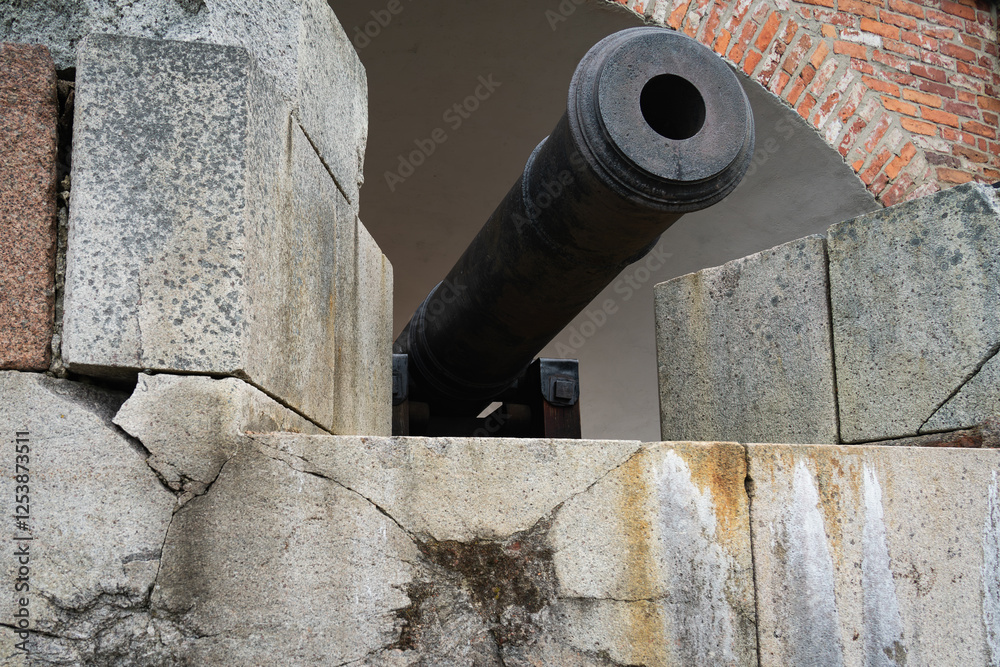 Weathered Stone Wall, Texture, and Cannon: A Historical Scene. Weathered Stone Wall, Texture, and Cannon: A Historical Scene.