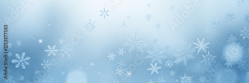 Frosty snowflakes on a frozen glass surface
