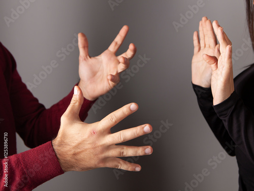 Closeup of aggressive man hand grabbed woman hand