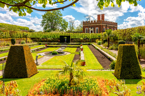 Little banqueting house in Privy gardens of Hampton Court palace in spring, London, UK