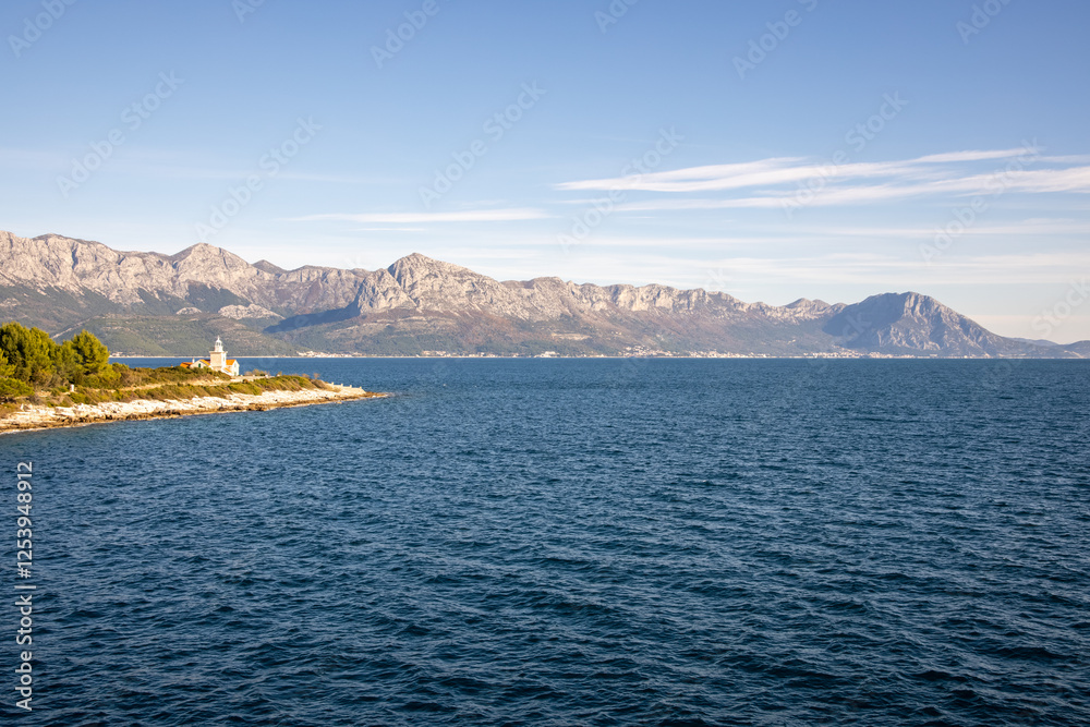 Idyllic Seaside Village with Majestic Backdrop Idyllic Seaside Village with Majestic Backdrop