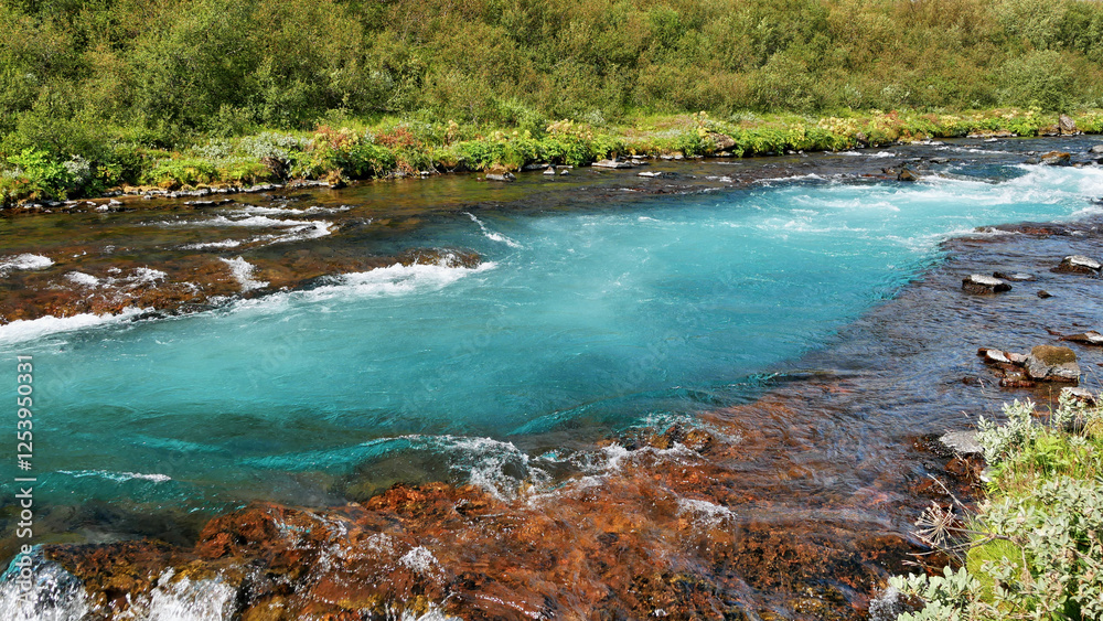 Blue river in green landscape in Iceland Blue river in green landscape in Iceland