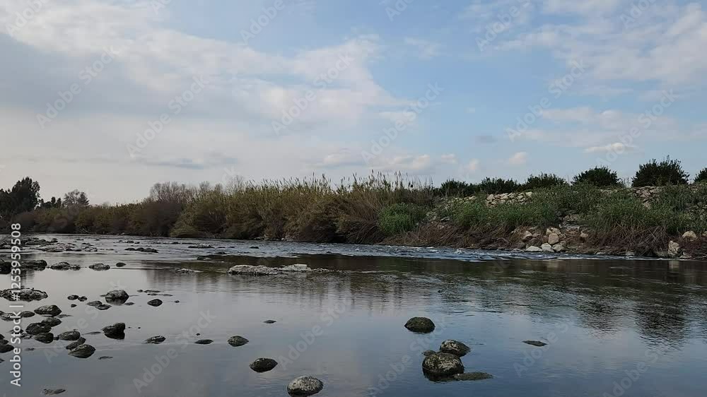 The picturesque Ceyhan River in Esenler village, Yuregir district, Adana province, shines with majesty on a February afternoon. The picturesque Ceyhan River in Esenler village, Yuregir district, Adana province, shines with majesty on a February afternoon.