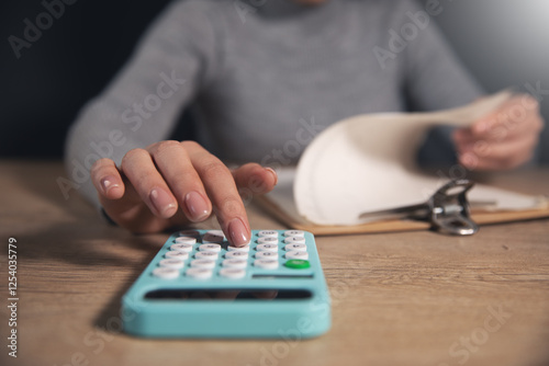 woman counting calculator with paper
