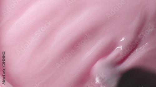 Soft pink texture of liquid gel nail polish