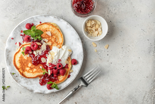 Fotografija Homemade pancakes with yoghurt, berries and raspberry jam