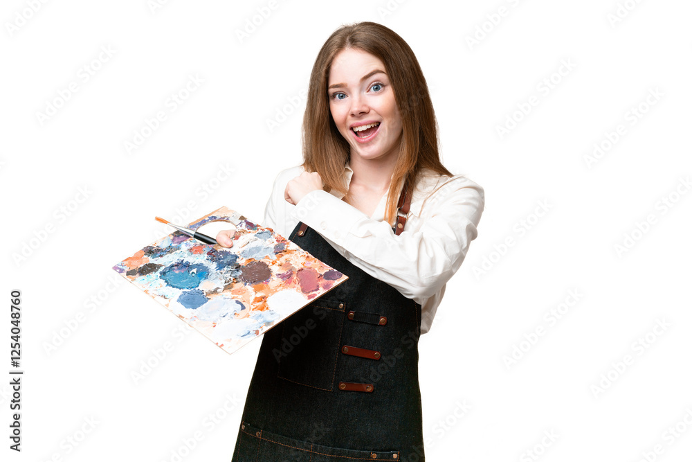 Young artist woman holding a palette over isolated chroma key background celebrating a victory Young artist woman holding a palette over isolated chroma key background celebrating a victory