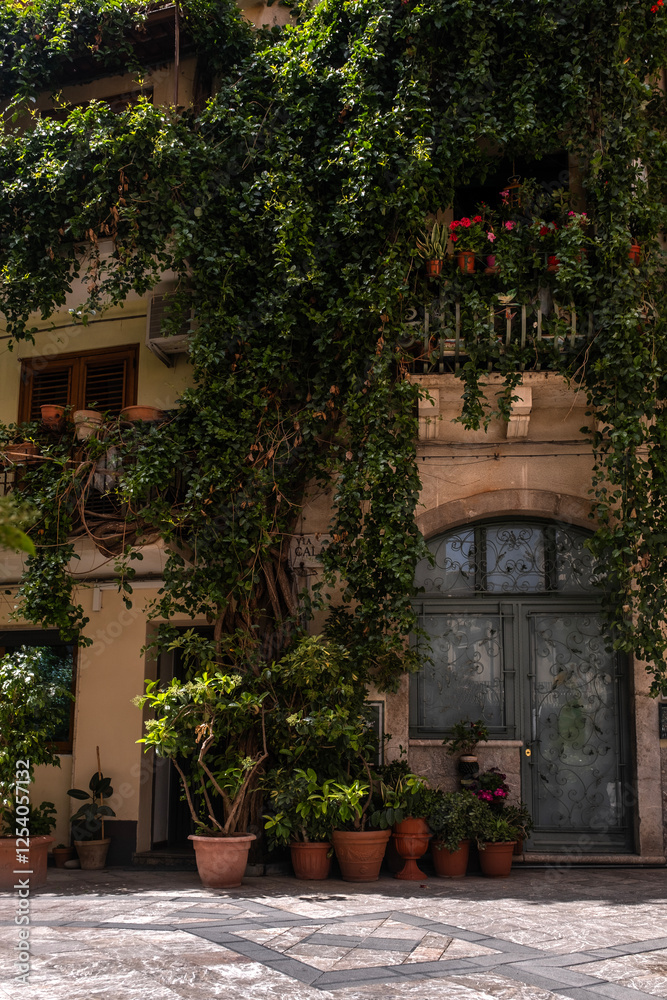 Naklejka premium Taormina, Italy. A narrow street in the old town
