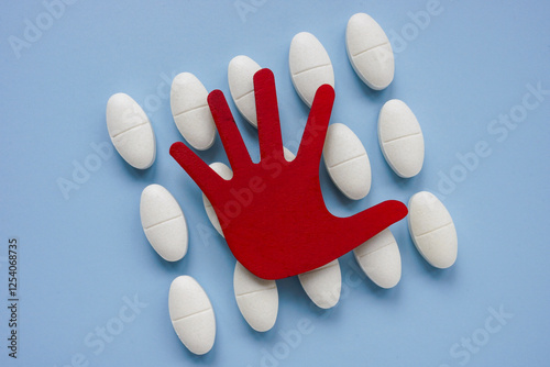 Billede på lærred Pills and a stopping hand. Drug refusal and medication control.
