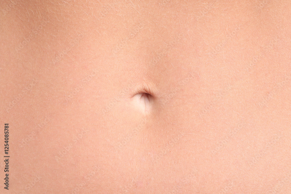 A close-up macro shot of a female navel, capturing the smooth skin and natural details of the belly area in a minimalist, intimate composition. A close-up macro shot of a female navel, capturing the smooth skin and natural details of the belly area in a minimalist, intimate composition.