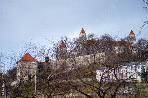 Bratislava Castle is massive rectangular building with four corner towers stands on an isolated rocky hill of the Little Carpathians in Bratislava photo