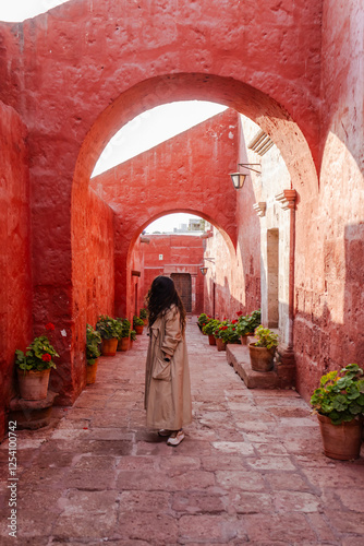 young woman standing in the middle of the road  photo