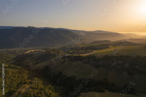 Sunset Over the Mountains with Autumn Forest and Misty Valley View in Carmel California