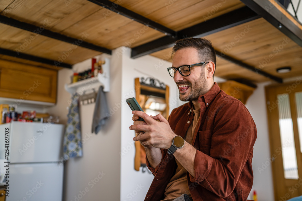 Man adult caucasian male use mobile phone smartphone happy smile Man adult caucasian male use mobile phone smartphone happy smile