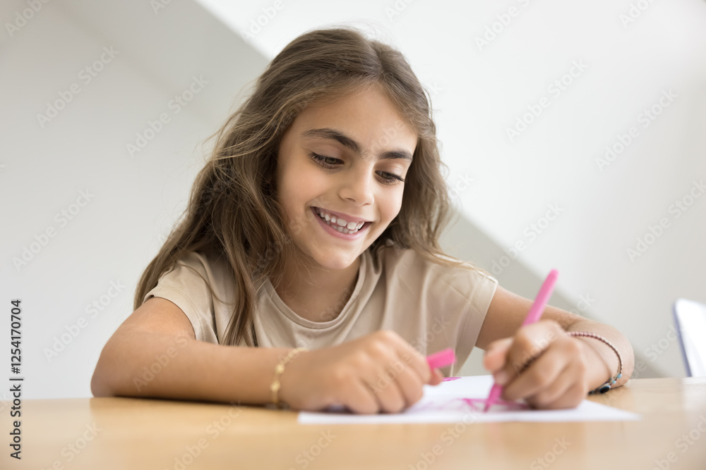 Close up little smiling focused kid girl, sitting at table, drawing with pink marker on paper, enjoy weekend joy, creativity, moment of carefree childhood, engages in fun, artistic activity at home Close up little smiling focused kid girl, sitting at table, drawing with pink marker on paper, enjoy weekend joy, creativity, moment of carefree childhood, engages in fun, artistic activity at home