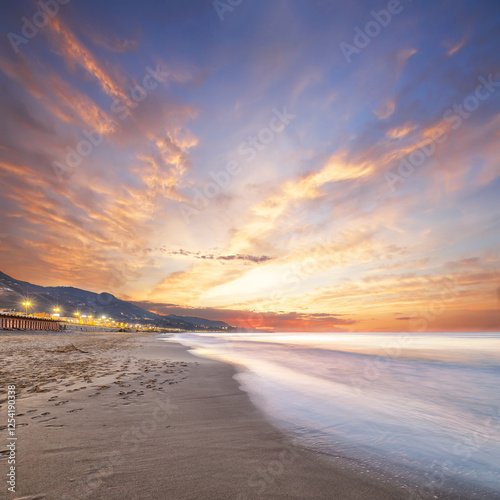 Fototapeta Naklejka Na Ścianę i Meble -  Beautiful evening landscape on the beach of Cefalu city.