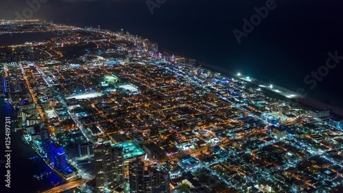 MIAMI, UNITED STATES - FEBRUARY 8, 2025: Stunning aerial view of Miami skyline at night showcasing vibrant city lights and waterfront attractions
