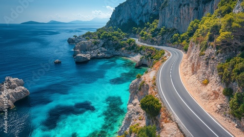 Coastal Highway Serenity: A winding road hugs the cliffs, revealing turquoise waters and dramatic rocky coastlines under a bright blue sky. Travel adventure awaits!
