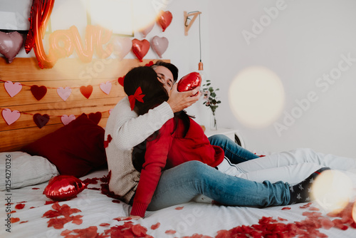 Romantic Couple on Valentine’s Day with Petals and Pet in Bedroom