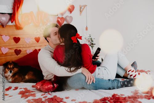 Romantic Couple on Valentine’s Day with Petals and Pet in Bedroom