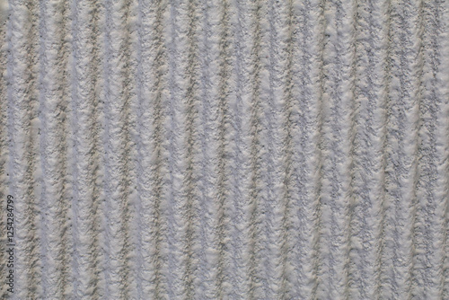 Gray Cement wavy wall Abstract Texture featuring vertical grooves for a rustic, industrial, or architectural aesthetic for backgrounds,