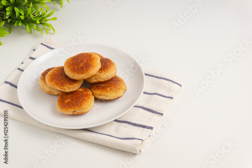 Kue kamir. Kamir cake on a white plate. Also called khamir. Perfect for recipe, article, catalogue, or any commercial purposes. photo