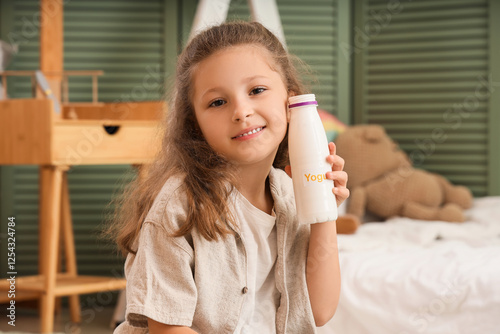 Cute little girl with bottl...