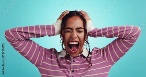 Psychology, anger and woman with screaming in studio for depression, mental health and conflict trauma. Bipolar, girl or shouting on blue background with stress for anxiety, overwhelmed and psychosis