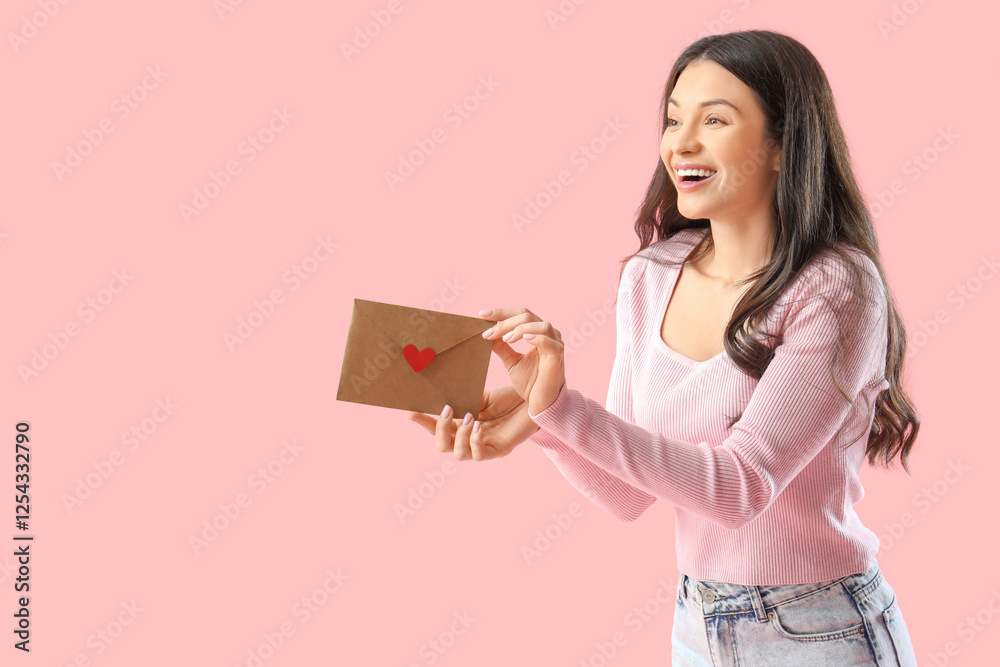 Happy young woman with envelope on pink background. Valentine's Day Happy young woman with envelope on pink background. Valentine's Day