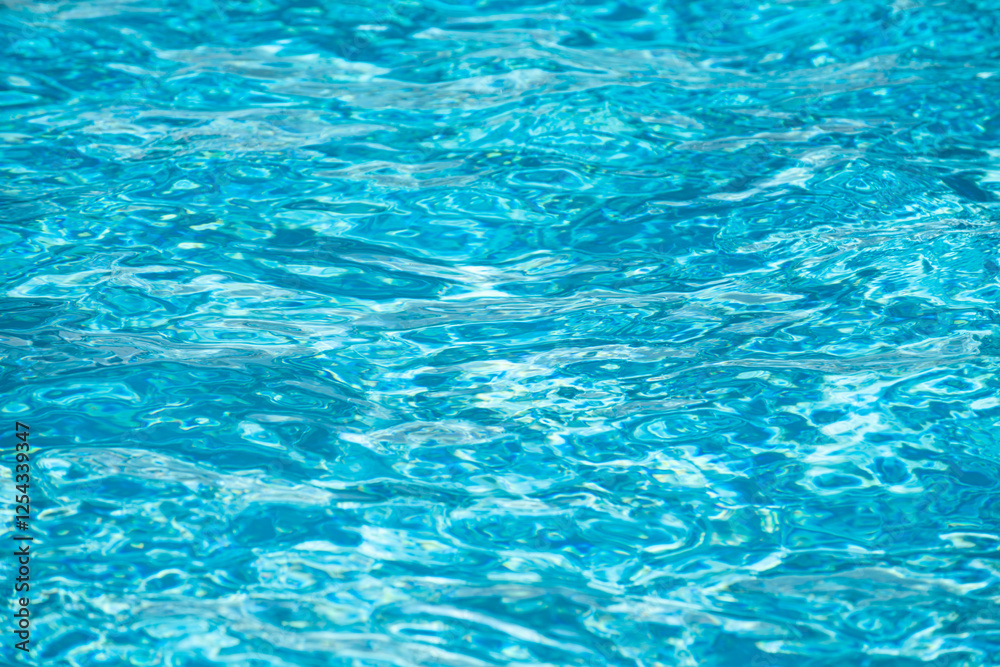 Water background. Blue water, ripples and highlights. Texture of water surface and tiled bottom. Water background. Blue water, ripples and highlights. Texture of water surface and tiled bottom.