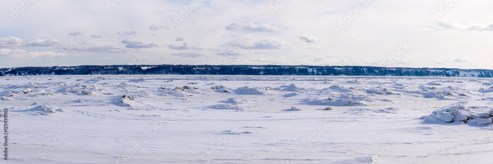 Winter landscape of the iced st Lawrence river in front of Neuville (Neuville, Québec, Canada) Winter landscape of the iced st Lawrence river in front of Neuville (Neuville, Québec, Canada)