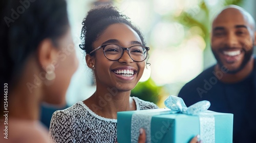 Graduate receiving a graduation gift from parents