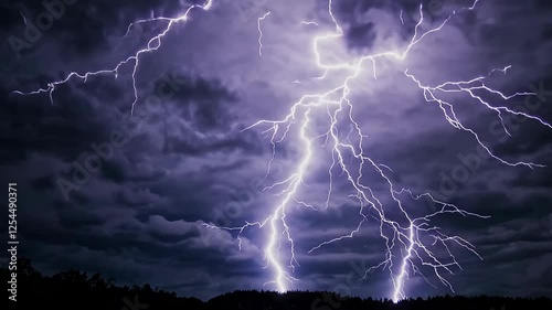 Lightning strike in night sky over silhouetted landscape, dramatic nature. Stormy weather and electric power concept