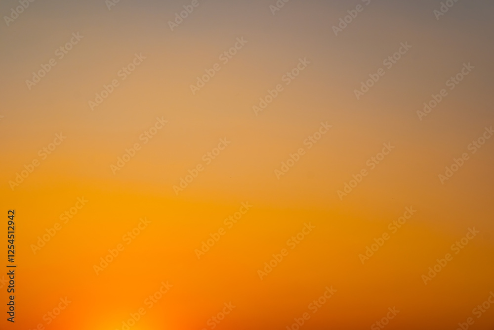 Naklejka premium Enjoy a panoramic view of the skyline. The sun rises in the morning sky with colorful clouds. and beautiful cloud patterns In the soft light of the morning 