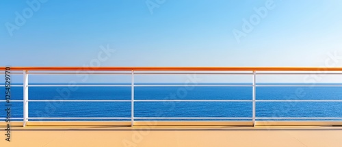 A serene view from a cruise ship deck, featuring a metal railing against a vibrant blue ocean and clear sky.