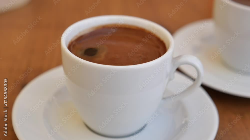 Enjoying rich coffee at a cozy cafe with friends in the morning Enjoying rich coffee at a cozy cafe with friends in the morning