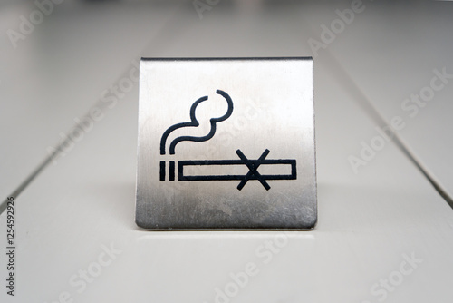 No smoking sign on table.