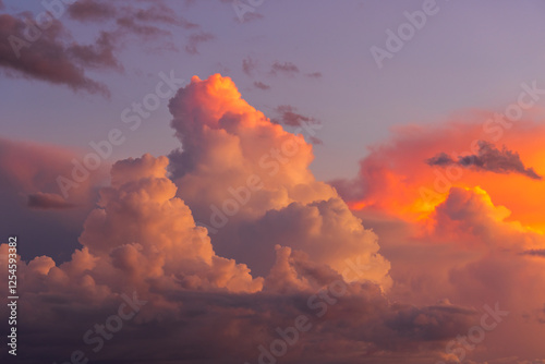 Fluffy white and pink cloud in twilight.