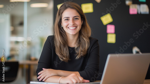 A portrait of a professional, happy businesswoman working in a startup agency in Brazil. She's reviewing products, writing blogs, and focused on career growth and development. As a photo