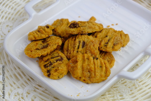 Popular cookies in Malaysia during celebration of Eid Mubarak (Hari Raya) on white isolated background called coffee and chips photo