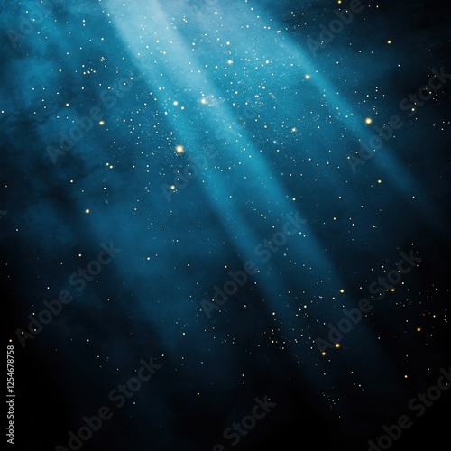 Blue light rays and golden particles on dark background with smoke effect and texture