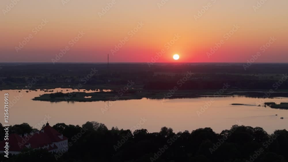Drone shot of red sun in rural Lithuania