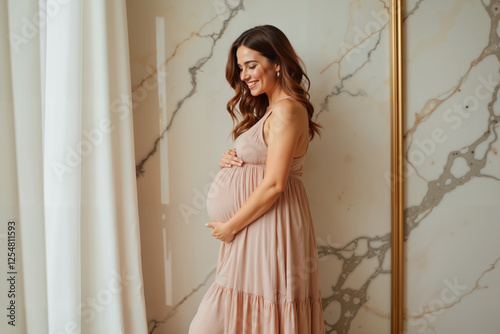 Pregnant woman smiling gently, ethereal gown against marble backdrop, maternity joy