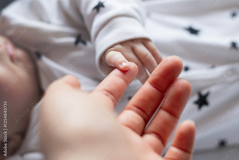 Fototapeta premium Newborn, hands and holding fingers with person in house, wellness and affection together for family bonding with baby. Bedroom, parent and relax with infant for care, childhood and growth with love