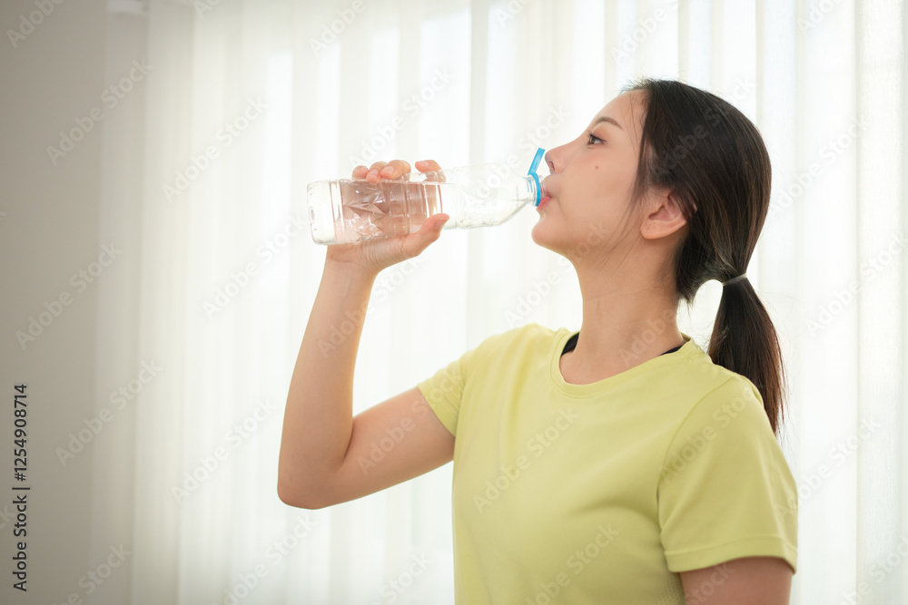Portrait of young sports women breaks and drinks water after yoga practice Portrait of young sports women breaks and drinks water after yoga practice