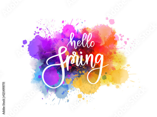 Hello spring - handwritten modern calligraphy inspirational text on multicolored watercolor paint splash. Background with abstract dots decoration.